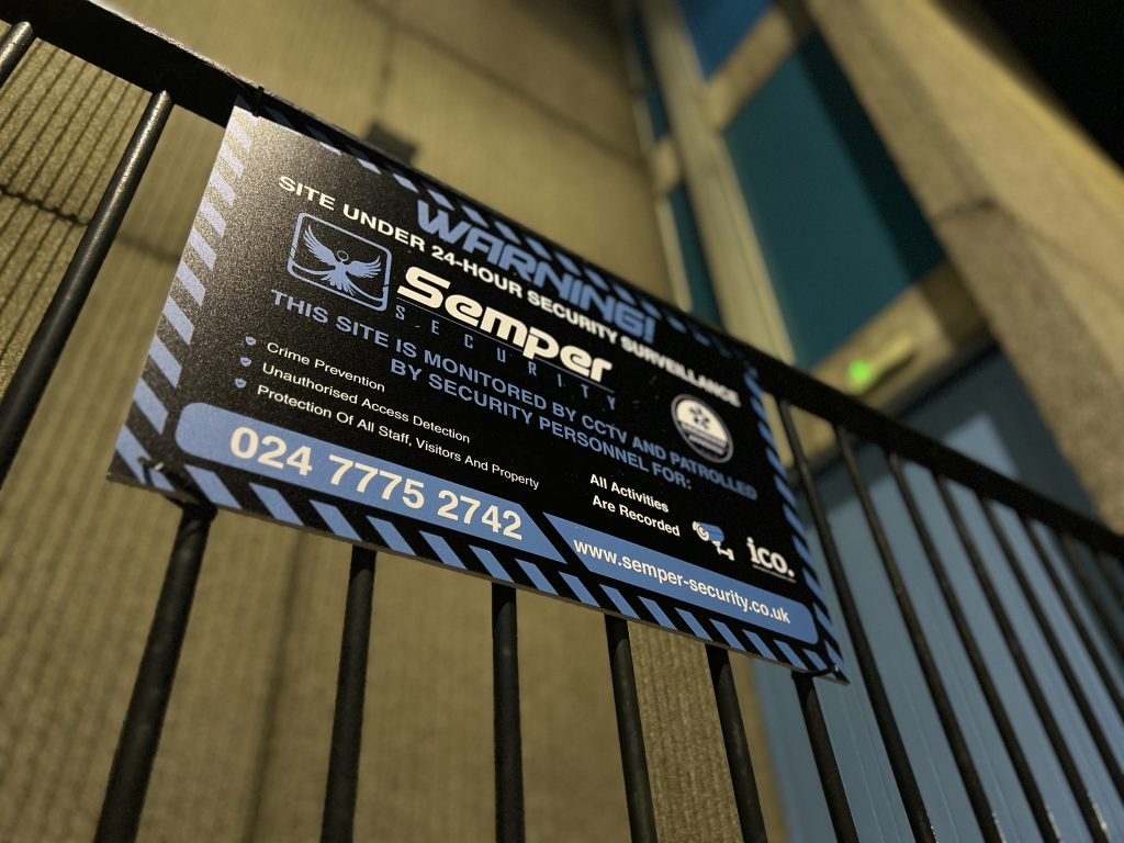 Semper Security warning sign on fencing at a monitored vacant property