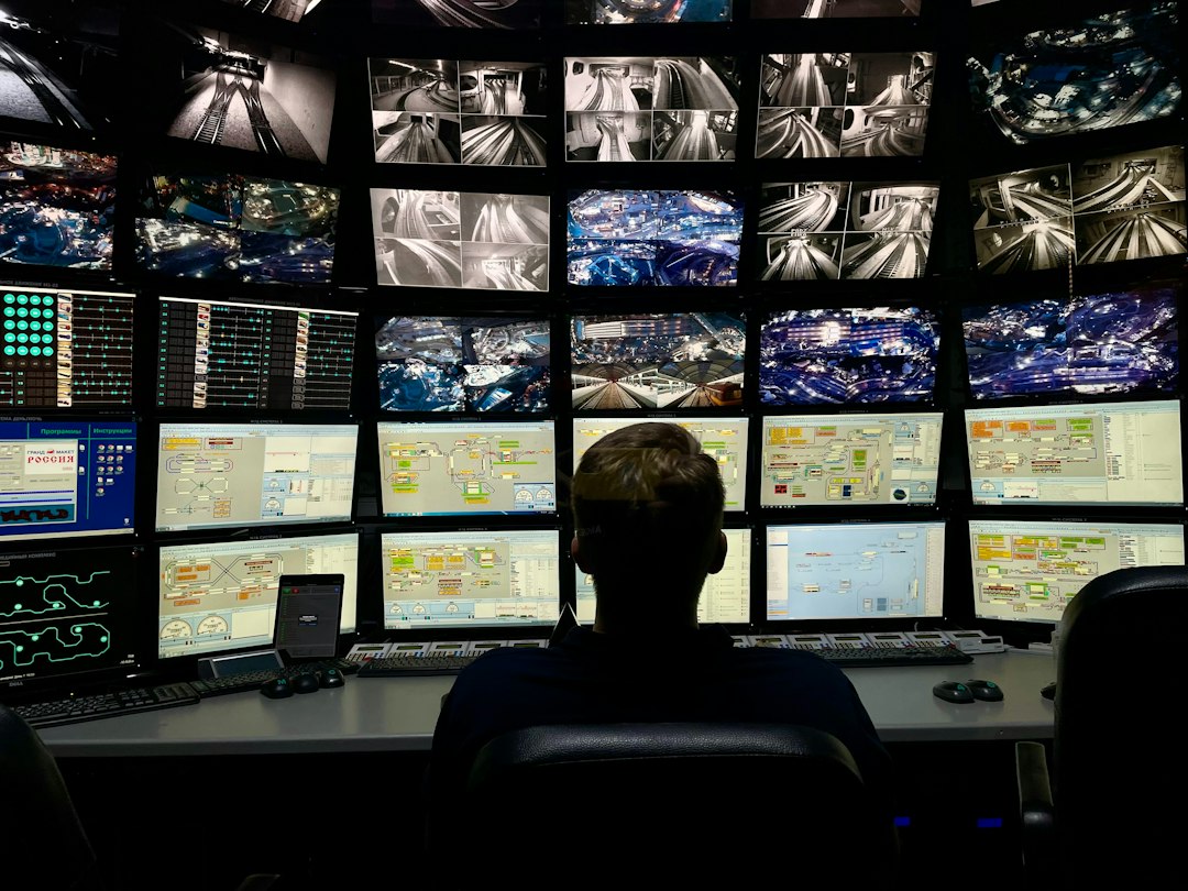 Multi-screen monitoring workstation illustrating CCTV security monitoring